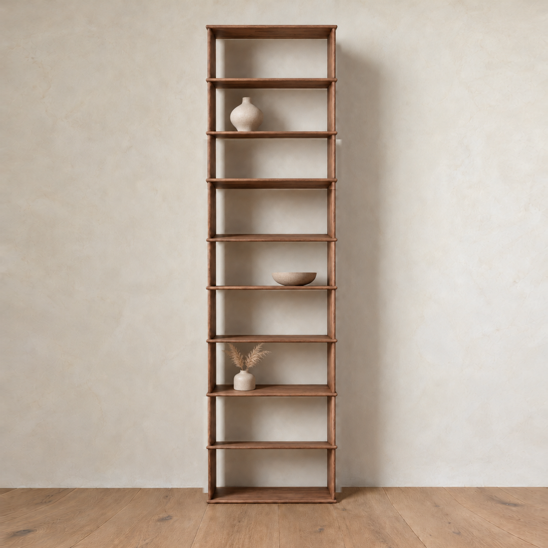 The 1 column 10 foot tall bookcase in walnut styled with a ceramic vase, a bowl and dried grass.