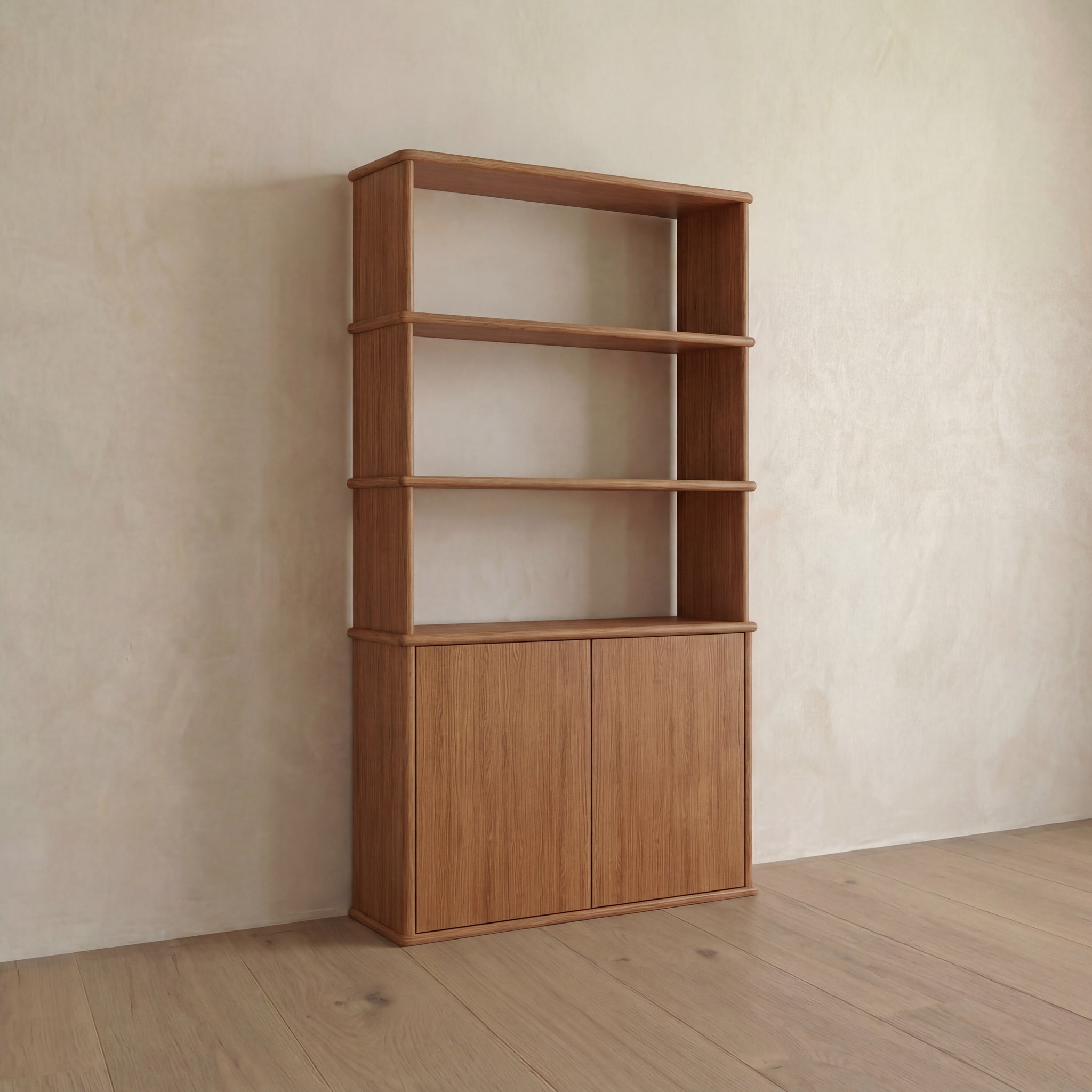 The Cabinet bookshelf in red oak features three open shelves above and a spacious closed cabinet with push-to-open doors at the bottom, making it an ideal blend of style and practicality for your Vancouver home.