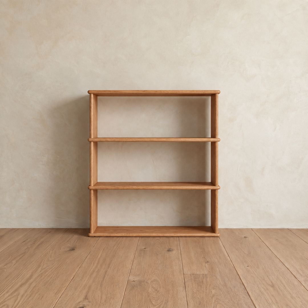 Front view of the empty 3 shelf bookcase in red oak, showing its open back and softly rounded shelf edges.