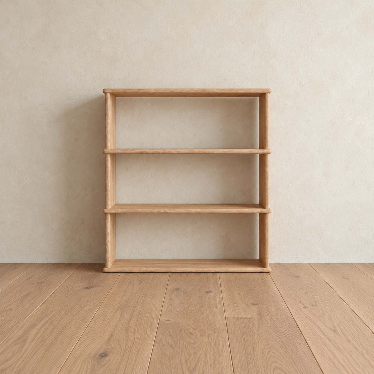 Front view of the empty 3 shelf bookcase in white oak, showing its open back and softly rounded shelf edges.