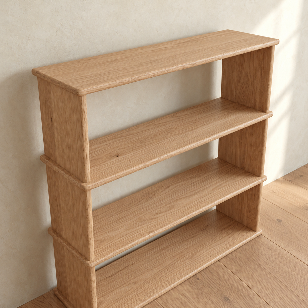 The 3 shelf bookcase in white oak from a high angle, showing the oak grain across the top and shelves and how each shelf extends slightly past the sides.