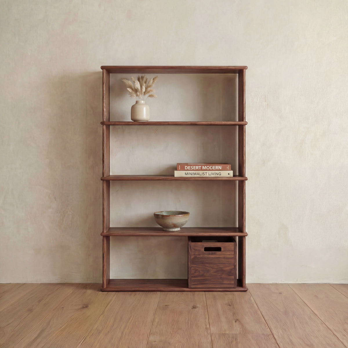 A 4 shelf bookcase in walnut stands against a beige wall on a wooden floor in Vancouver, displaying a vase with dried flowers, stacked books, a ceramic bowl, and a wooden storage box for a minimalist, natural look.