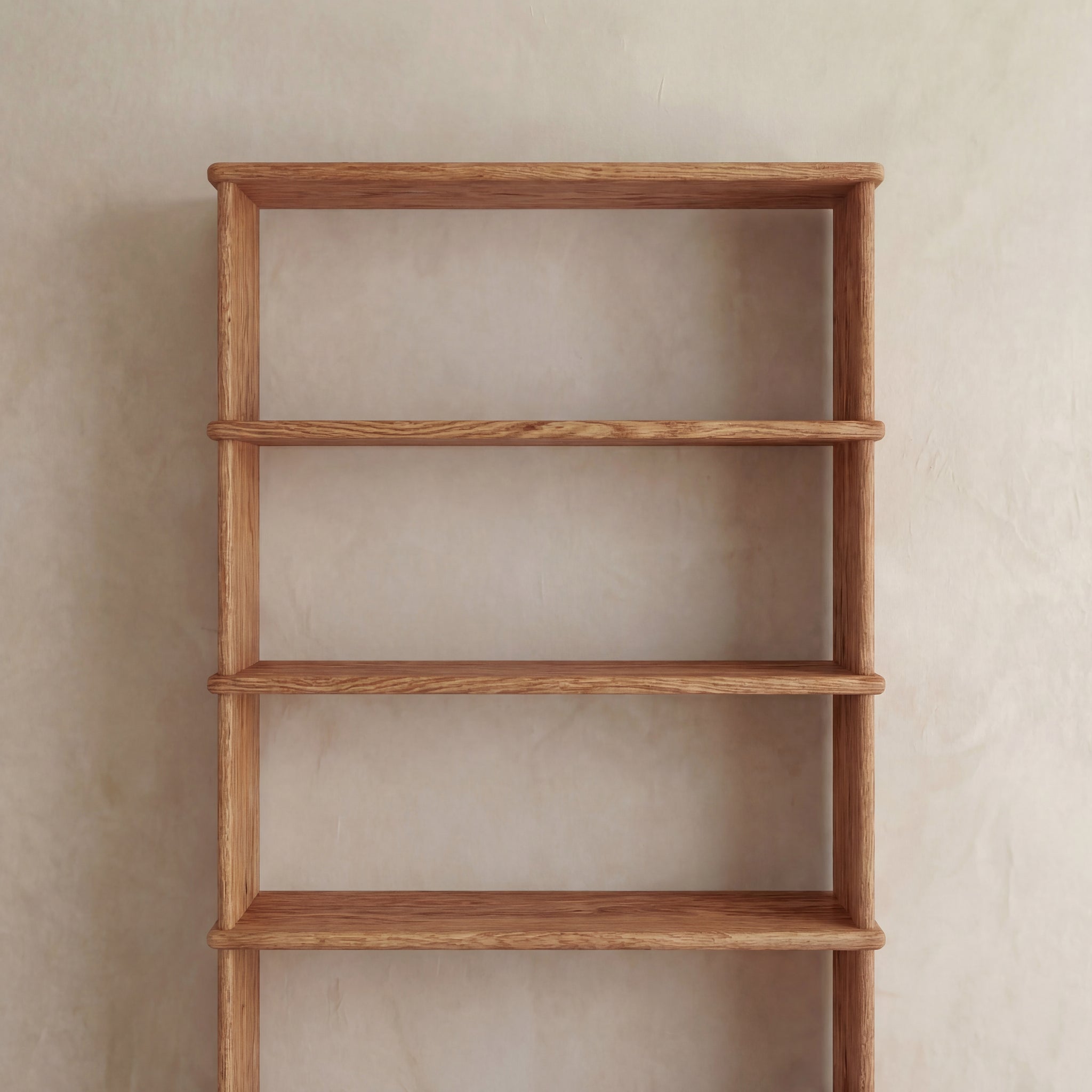 A 5 shelf bookcase in red oak with a smooth finish and minimalist design stands empty against a plain beige wall.