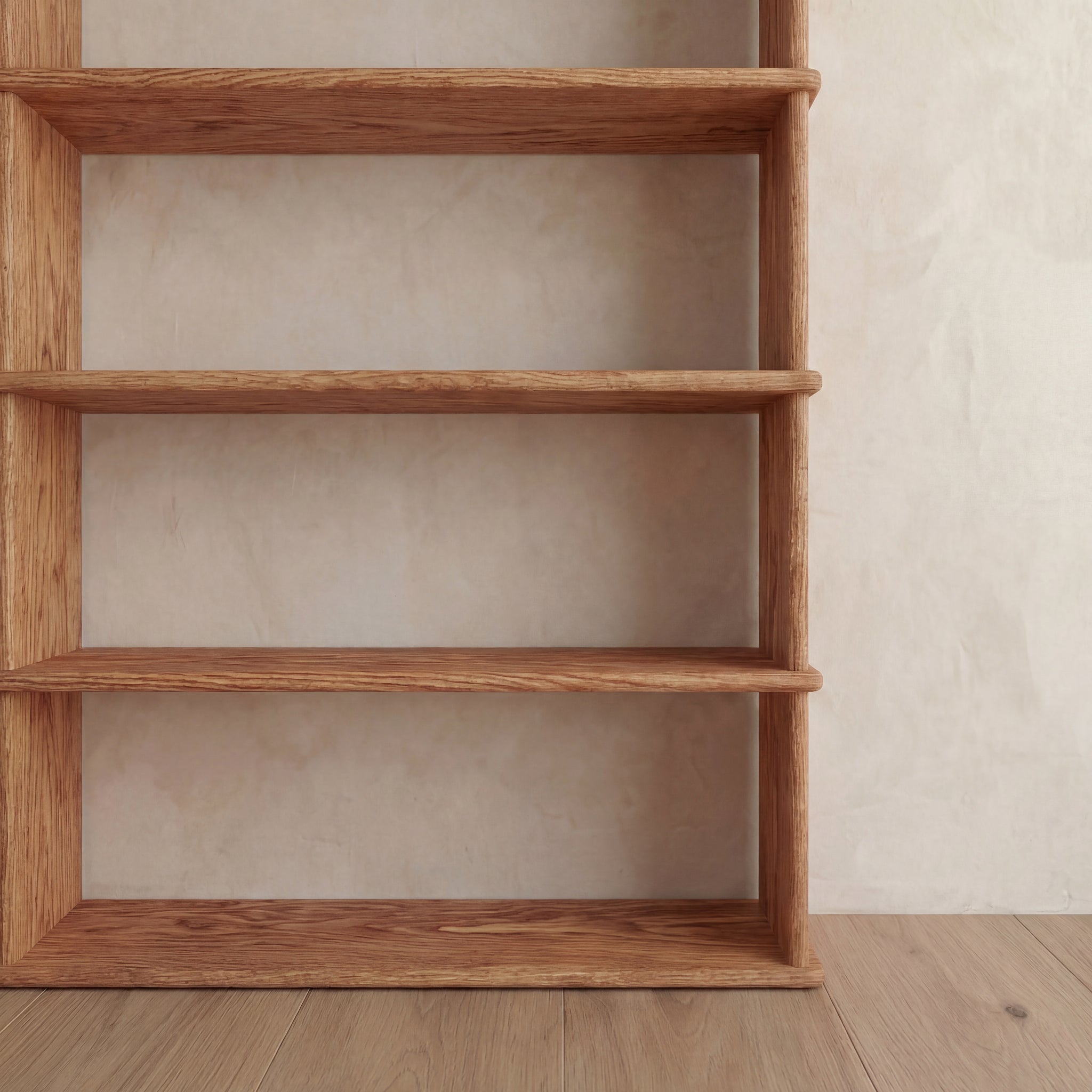 A 5 shelf bookcase in red oak with four visible shelves stands against a beige textured wall on a wooden floor, positioned on the left side of the image.