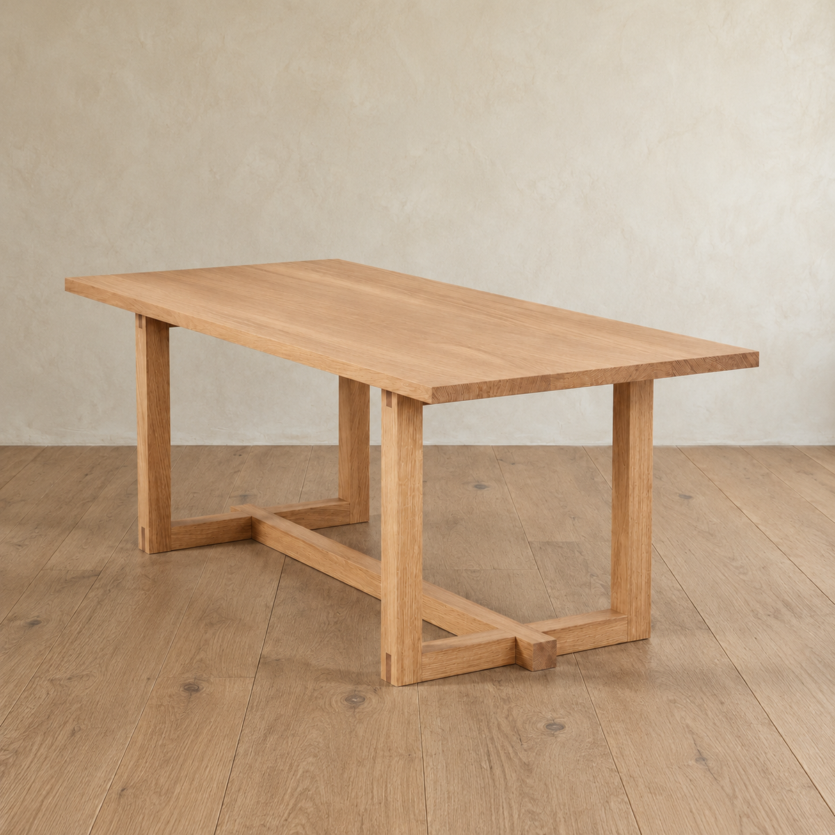 Rectangular solid white oak 6 person dining table with a trestle base.