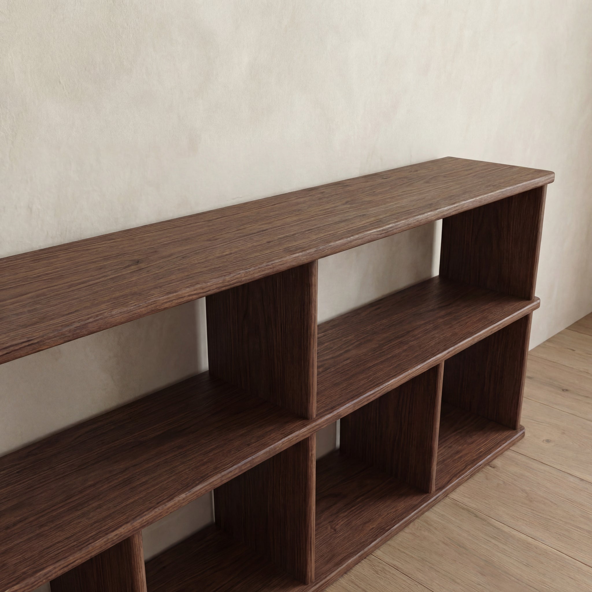 The 65 inch bookshelf TV stand in walnut features two levels and multiple open compartments, making it ideal for up to a 65 inch display and perfect against light walls on wooden floors.