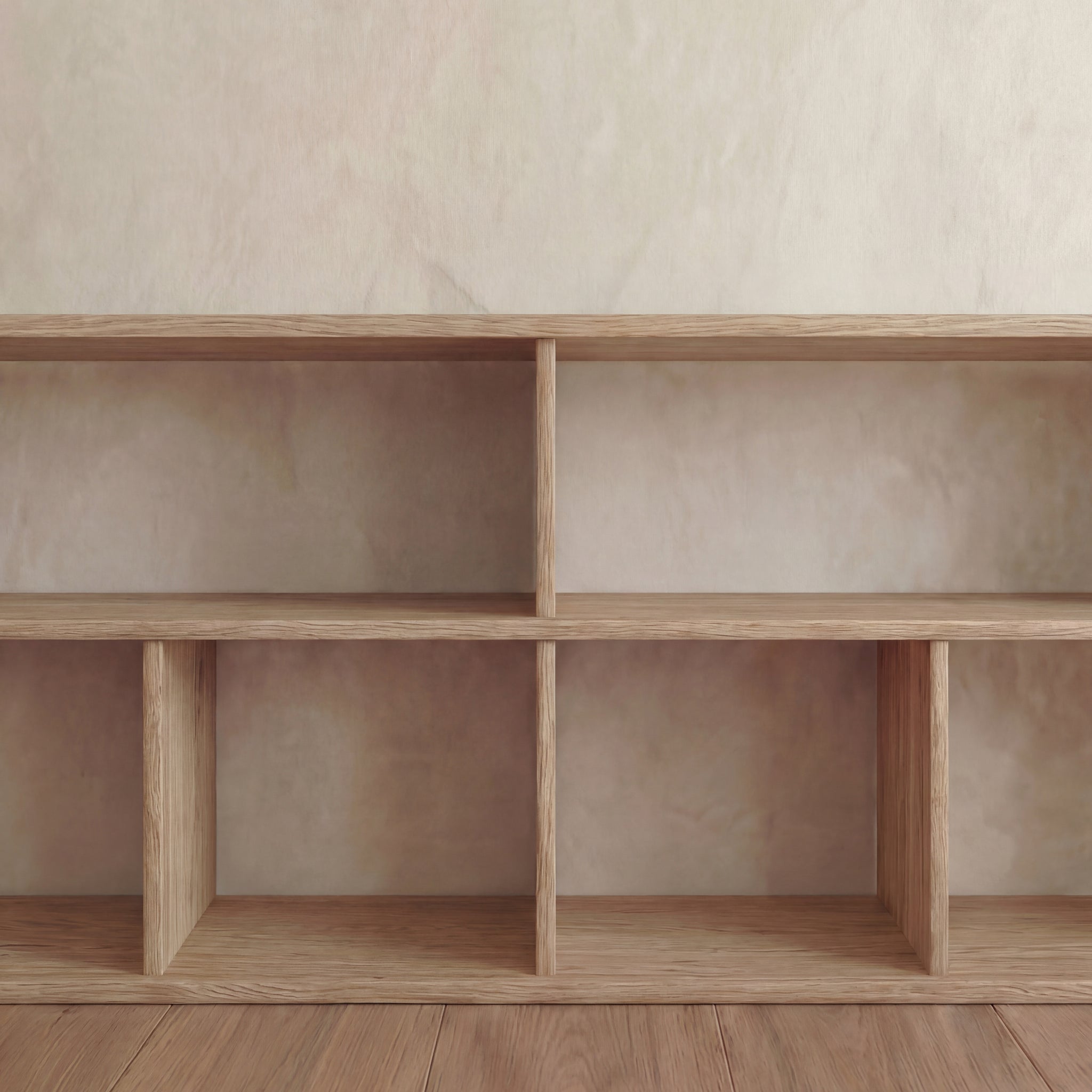A 65 inch bookshelf TV stand in white oak, featuring six empty square compartments, stands against a beige wall on a wooden floor, offering both storage and style.