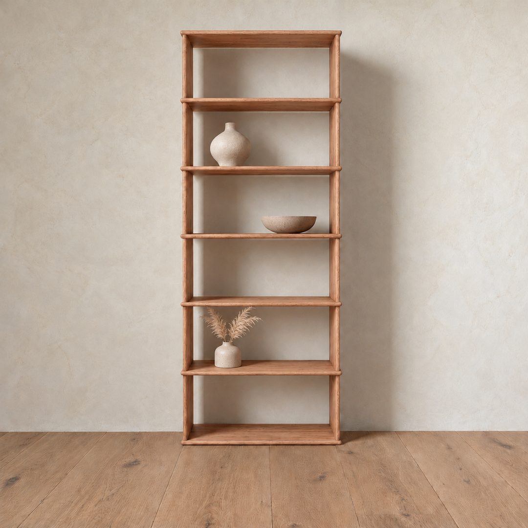 The 1 column 7 foot tall bookcase in red oak styled with a ceramic vase, a bowl and dried grass.