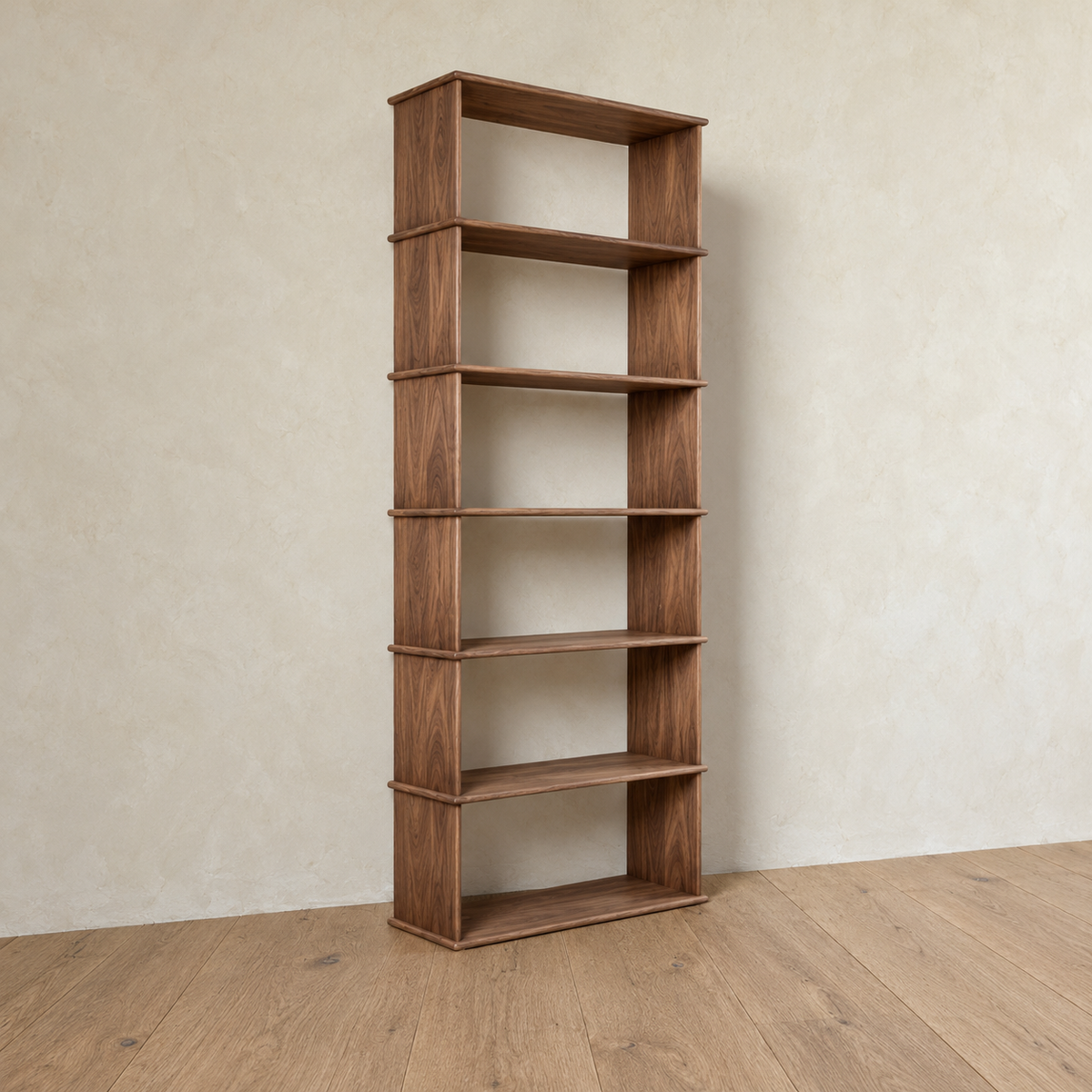 The 1 column 7 foot tall bookcase in walnut from an angle, showing its softly rounded shelf edges.