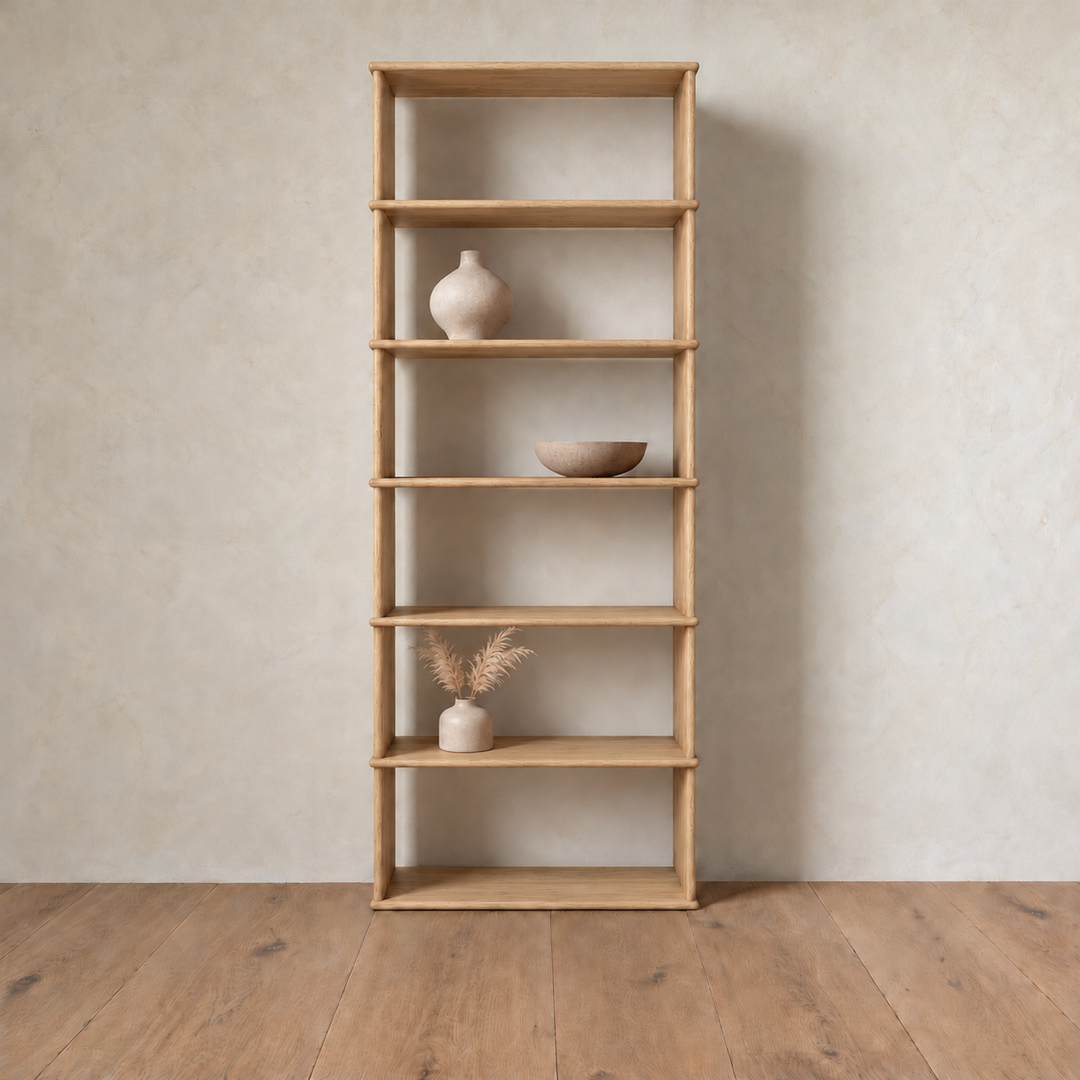 The 1 column 7 foot tall bookcase in white oak styled with a ceramic vase, a bowl and dried grass.