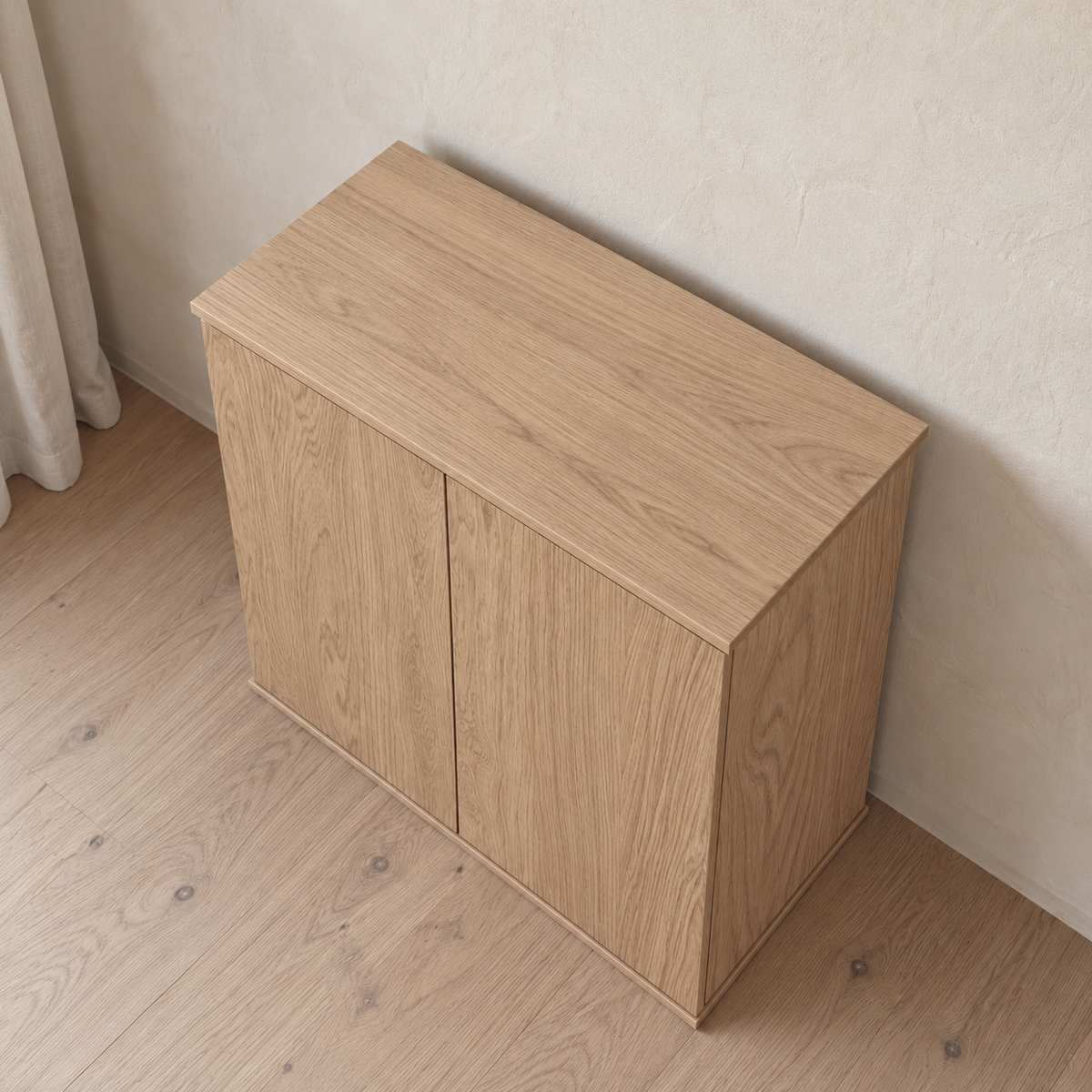 Top-down view of a Two door cabinet in white oak with a minimalist design.