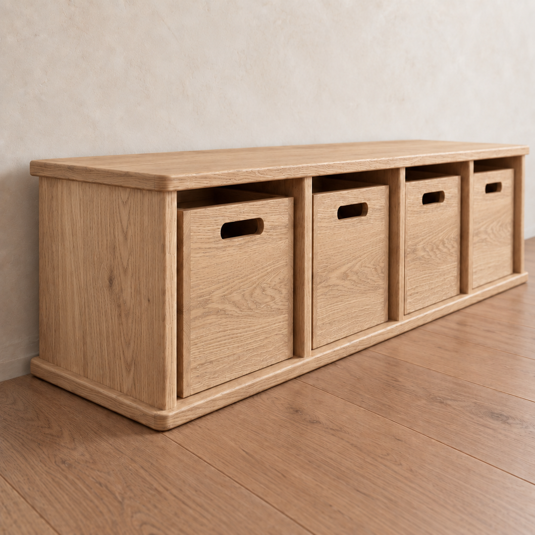 Entryway cubby bench in red oak featuring four square cubby compartments, each containing a matching wooden bin with a cutout handle.