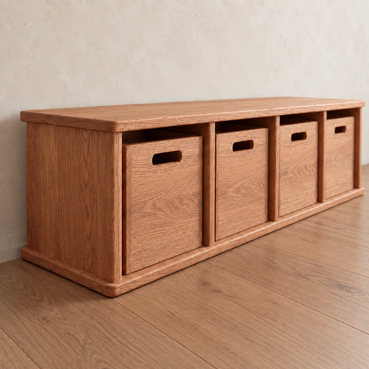 Entryway cubby bench in red oak featuring four square cubbies, each containing a matching wooden drawer with a cutout handle.