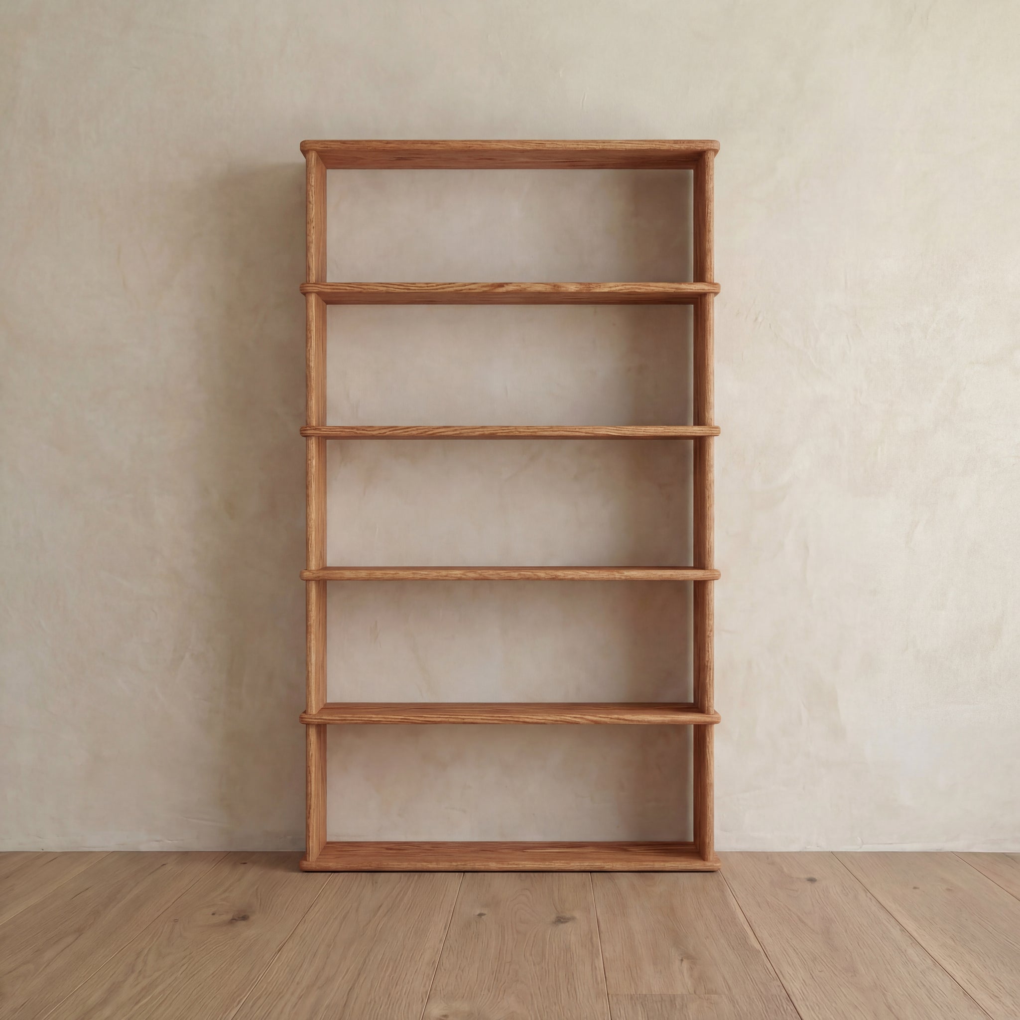 The 5 shelf bookcase in red oak stands tall and empty against a light beige wall on a wooden floor, showcasing its handcrafted solid red oak design.