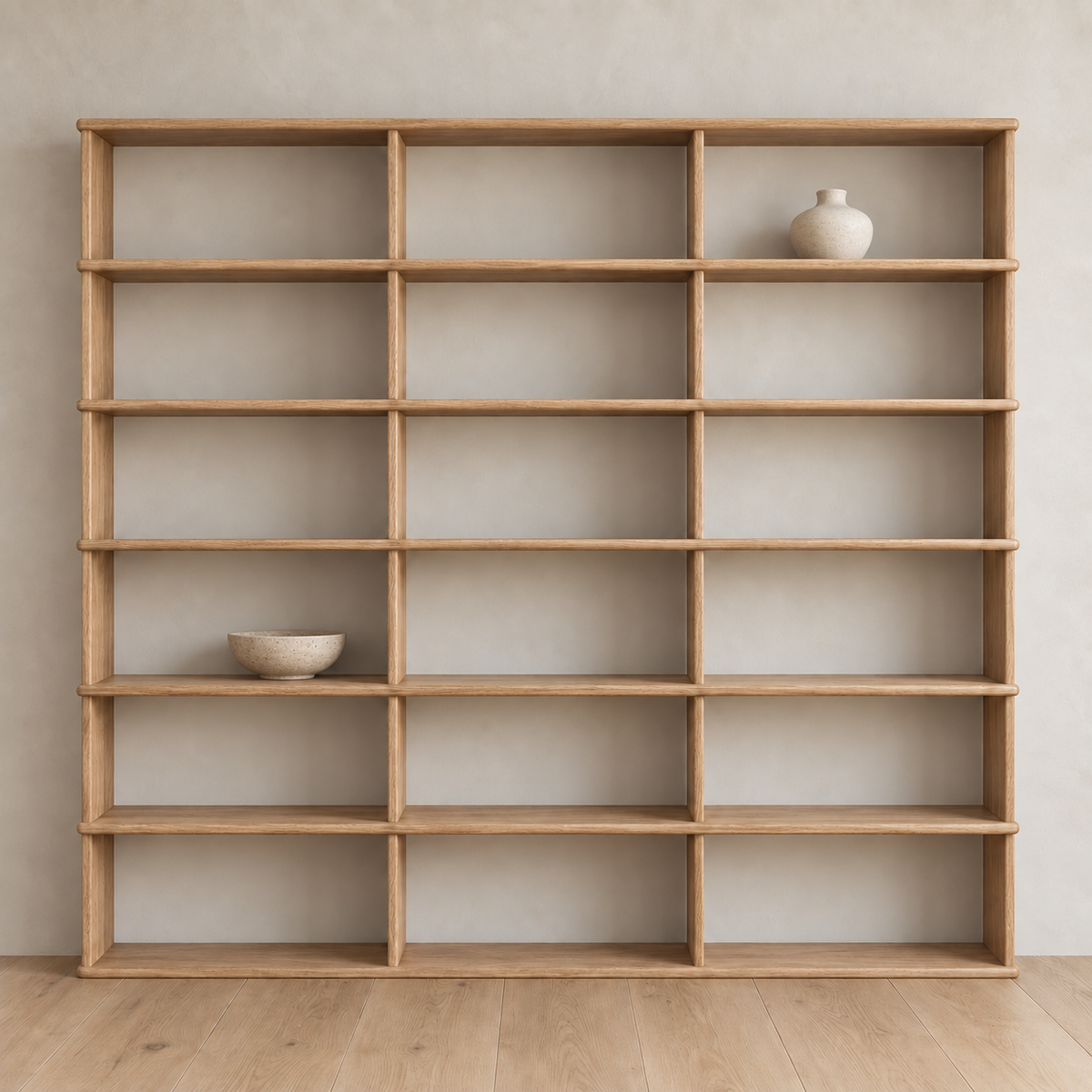 Full wall bookcase in white oak — with decor