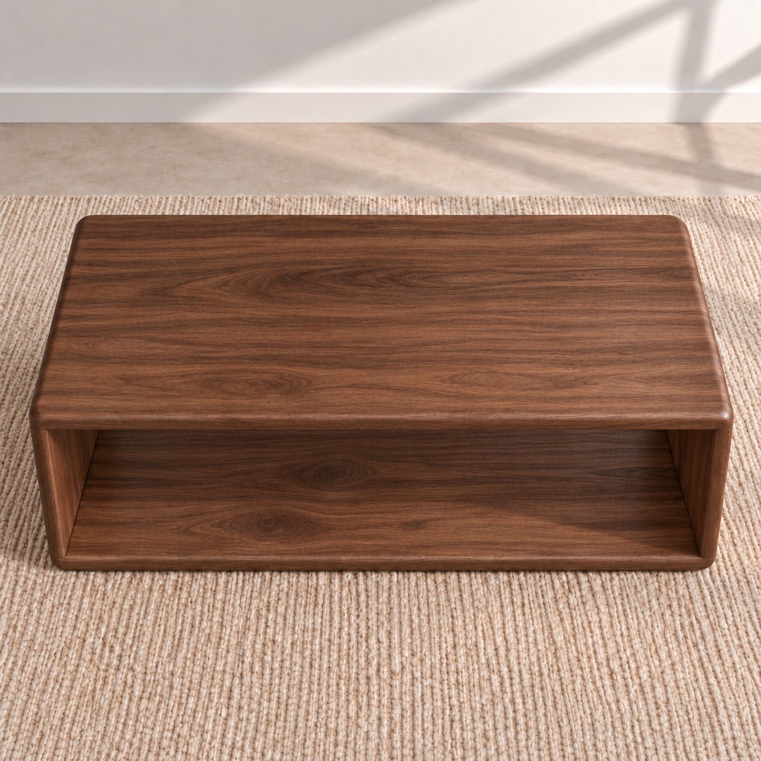 The Japandi coffee table in walnut seen from above, showing the grain of the solid top and the open shelf below it.