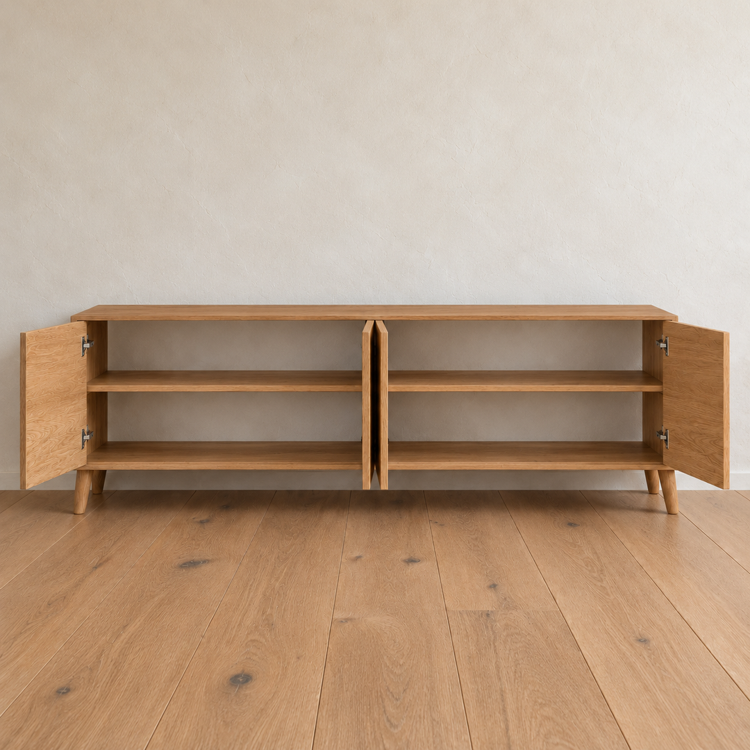 The media console in white oak with all four doors open, showing two compartments with a shelf in each.