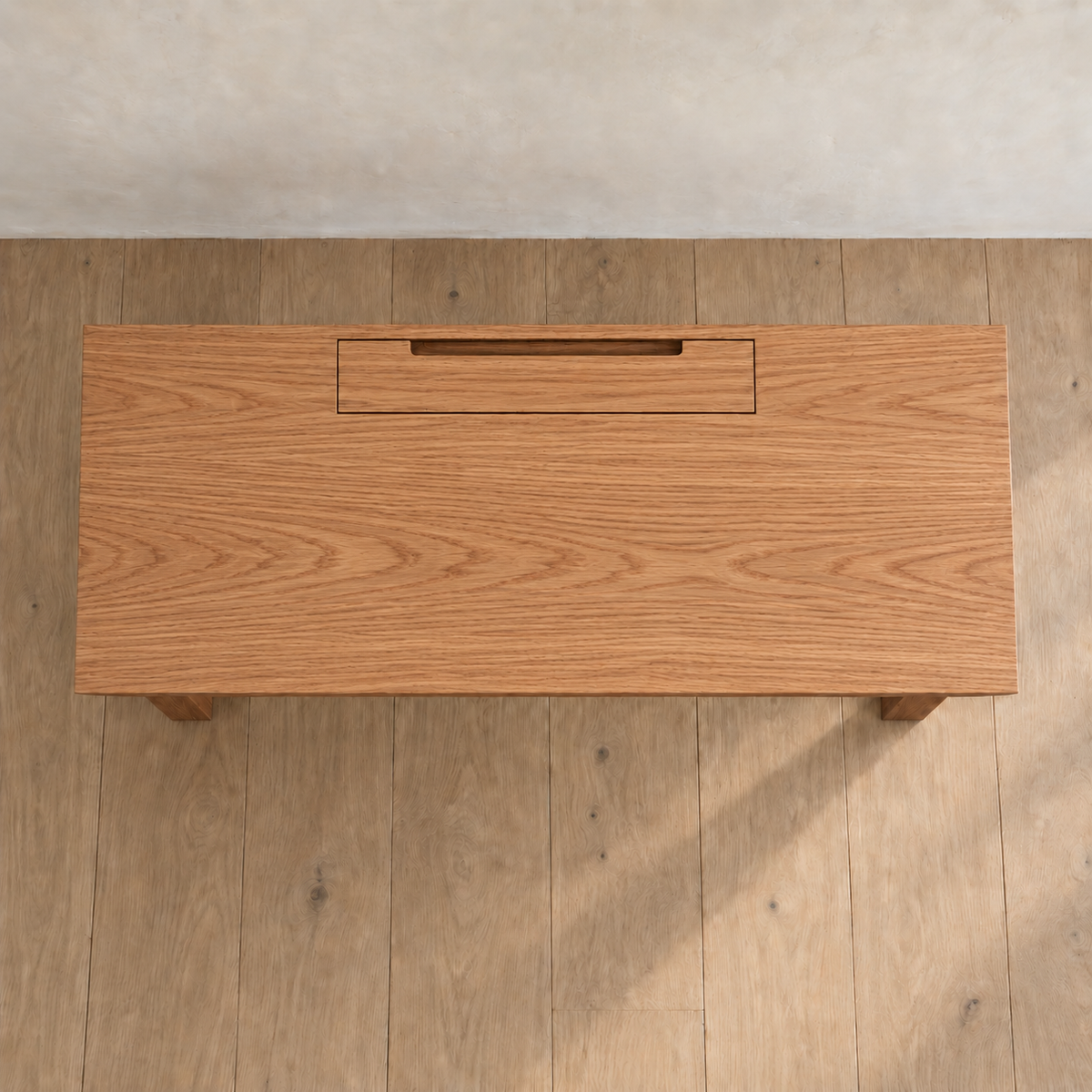 Minimalist office desk in red oak — top view
