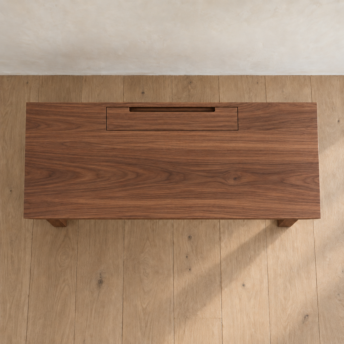 Minimalist office desk in walnut — top view