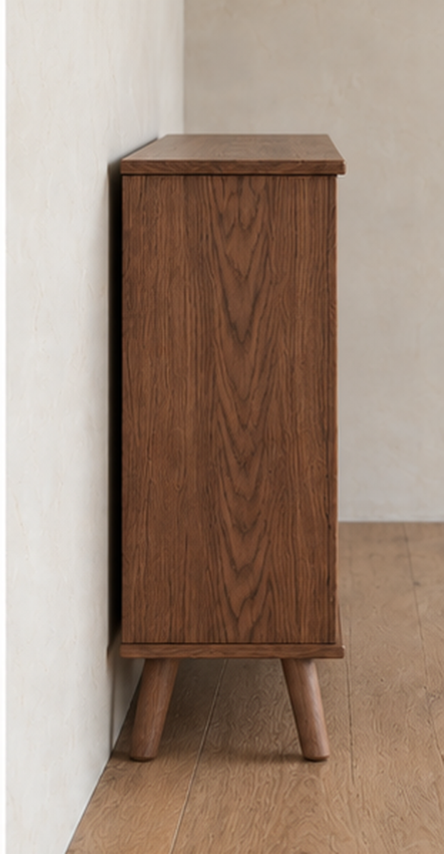 Side view of the rattan cabinet in walnut, showing the solid walnut side panel and splayed tapered legs.