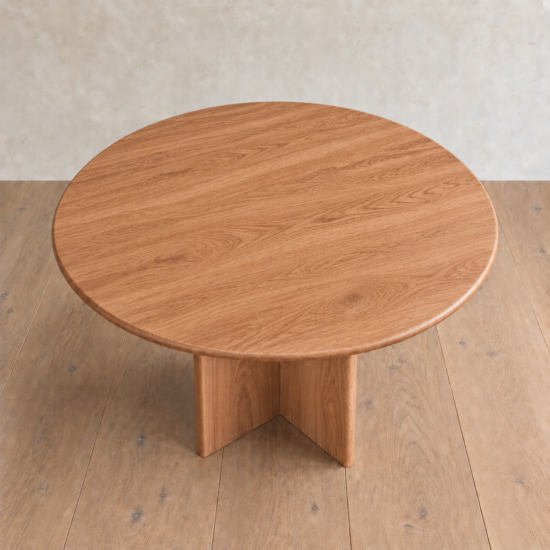 Round dining table in red oak — high angle