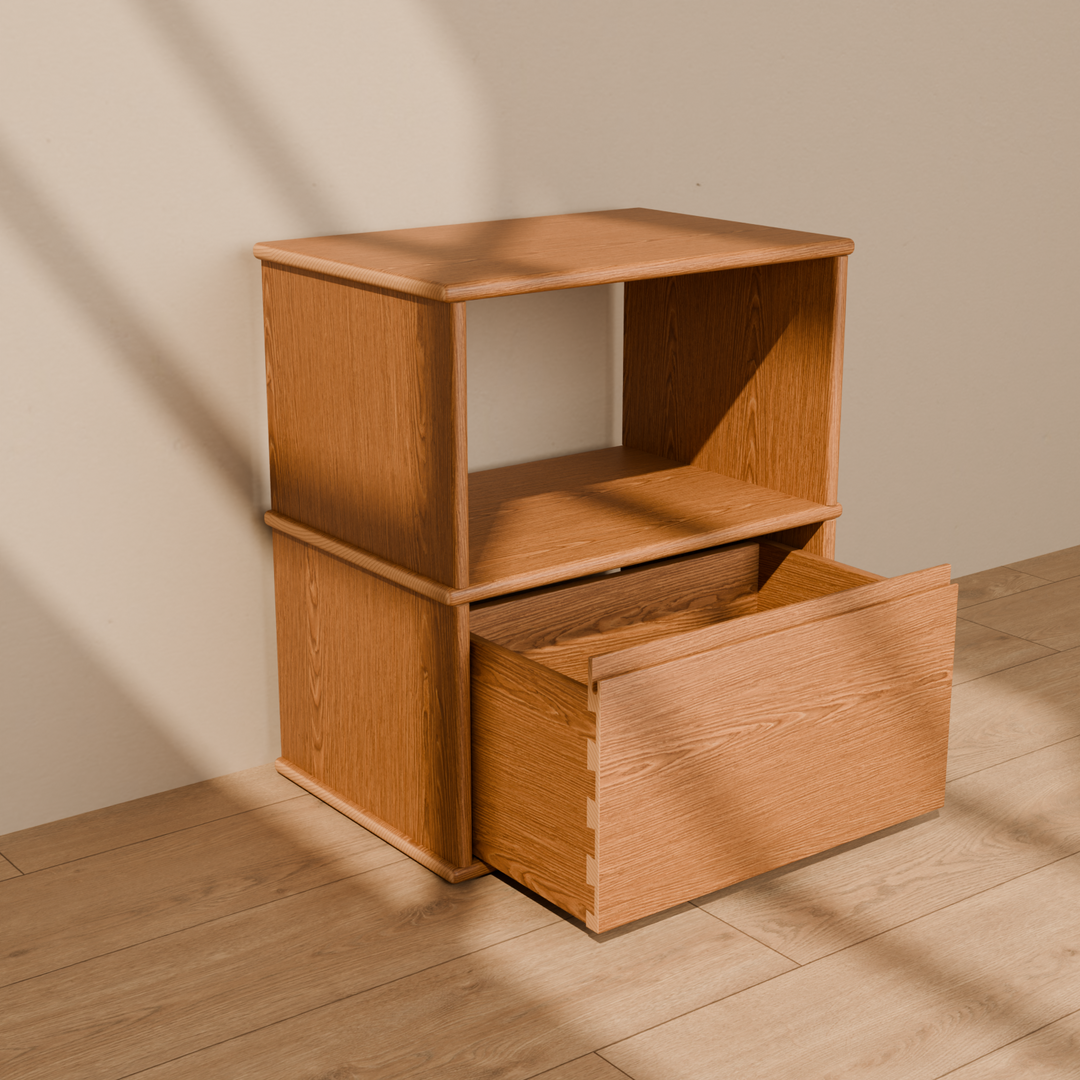 The solid wood nightstand in red oak with its drawer pulled open, showing the dovetailed drawer box.