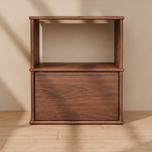 Front view of the solid wood nightstand in walnut, showing the open shelf, the drawer and the rounded edges of the top, shelf and base.