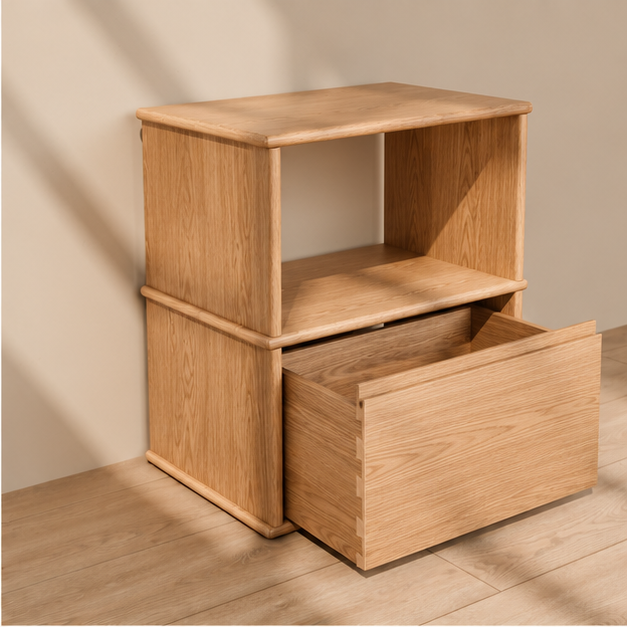 The solid wood nightstand in white oak with its drawer pulled open, showing the dovetailed drawer box.