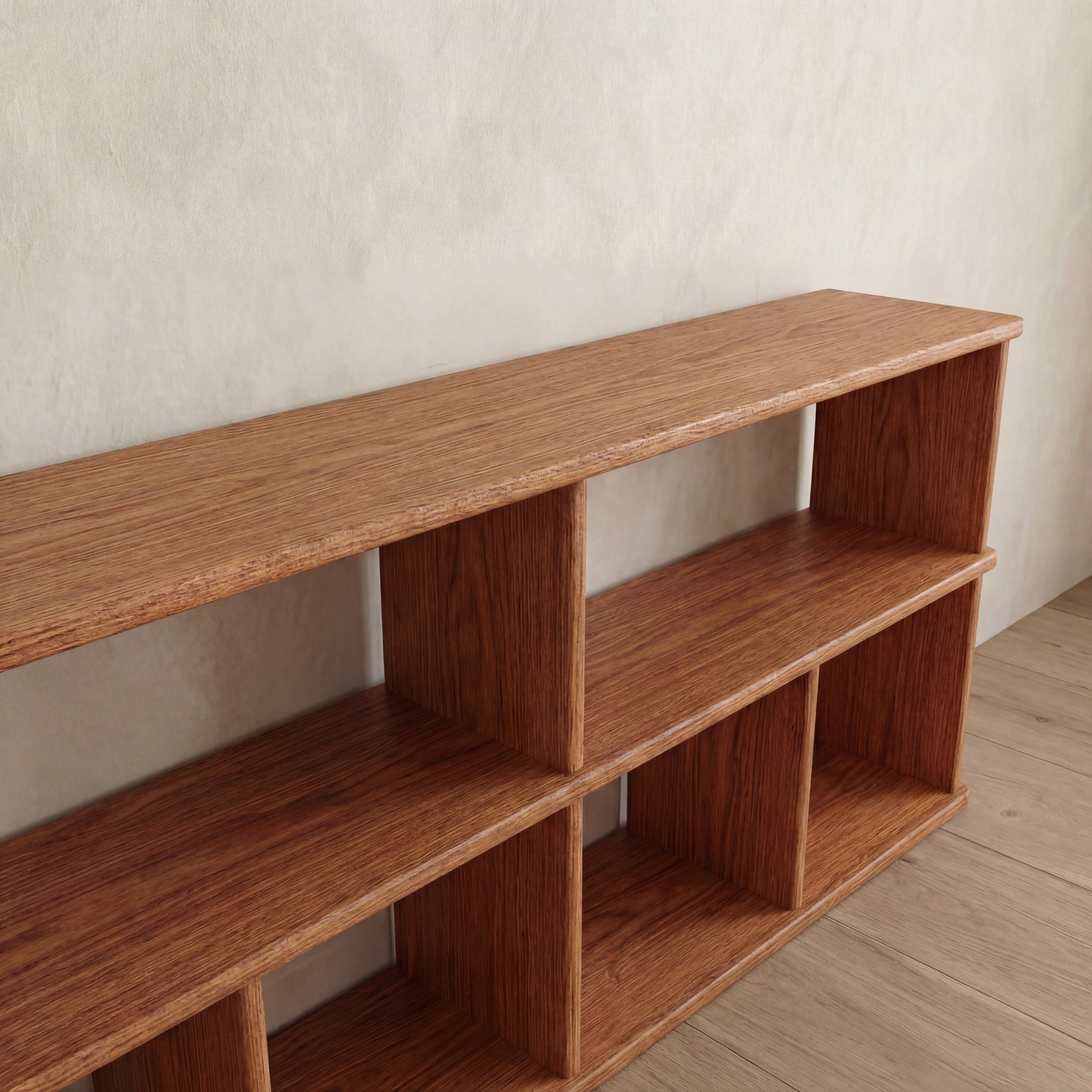 A 65 inch bookshelf TV stand in red oak with two levels and six open compartments, positioned against a light-colored wall on a wooden floor.
