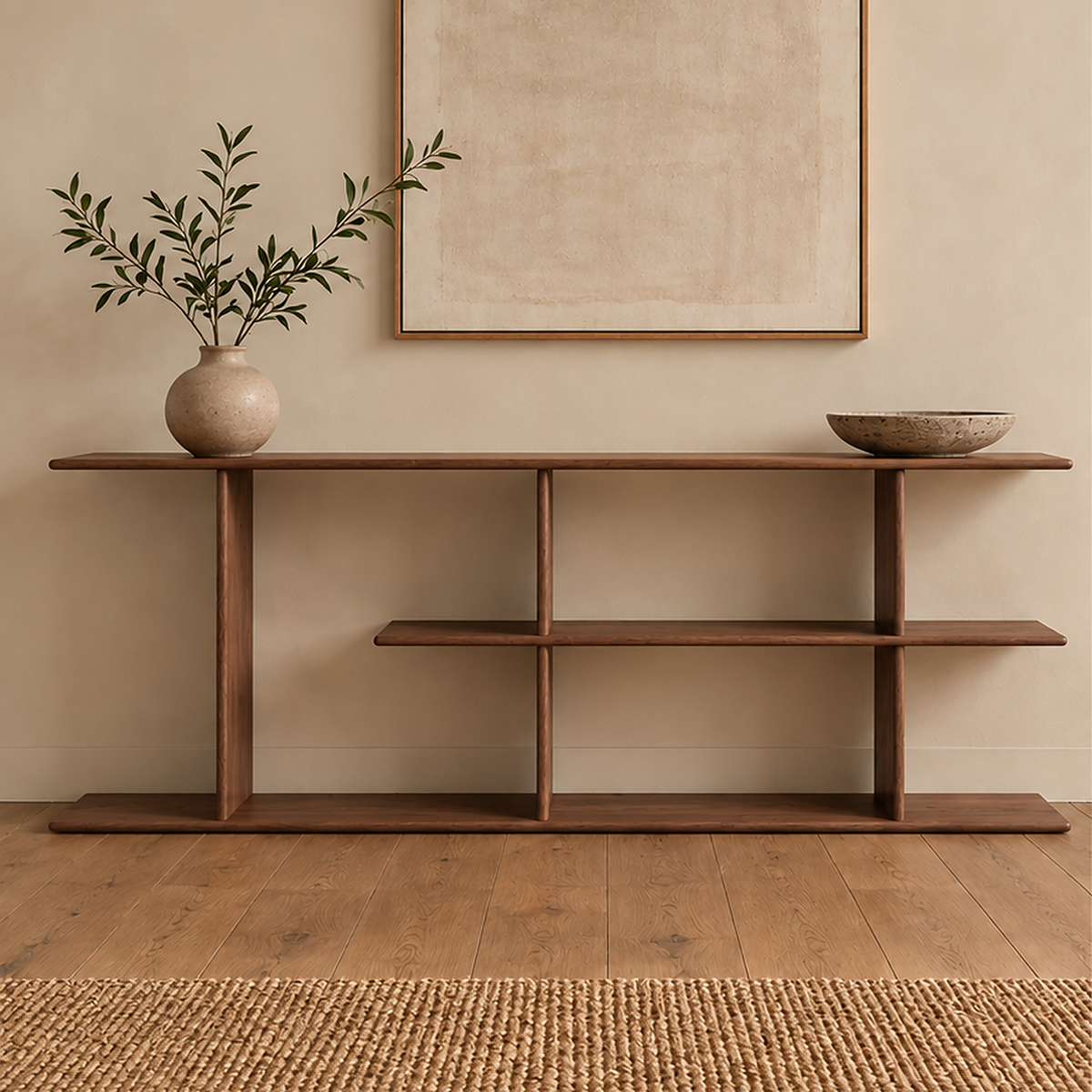 The staggered shelf bookcase in walnut styled with a vase of olive branches and a stone bowl, below a framed print.
