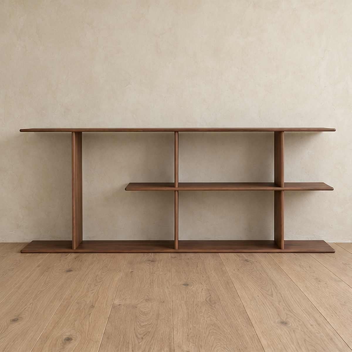 Front view of the empty staggered shelf bookcase in walnut, with its middle shelf running two thirds of the way across.