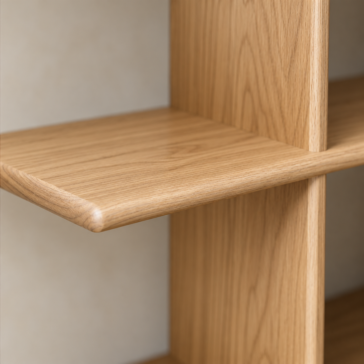 Close-up of the softly rounded corner of the middle shelf where it meets an upright, in white oak.