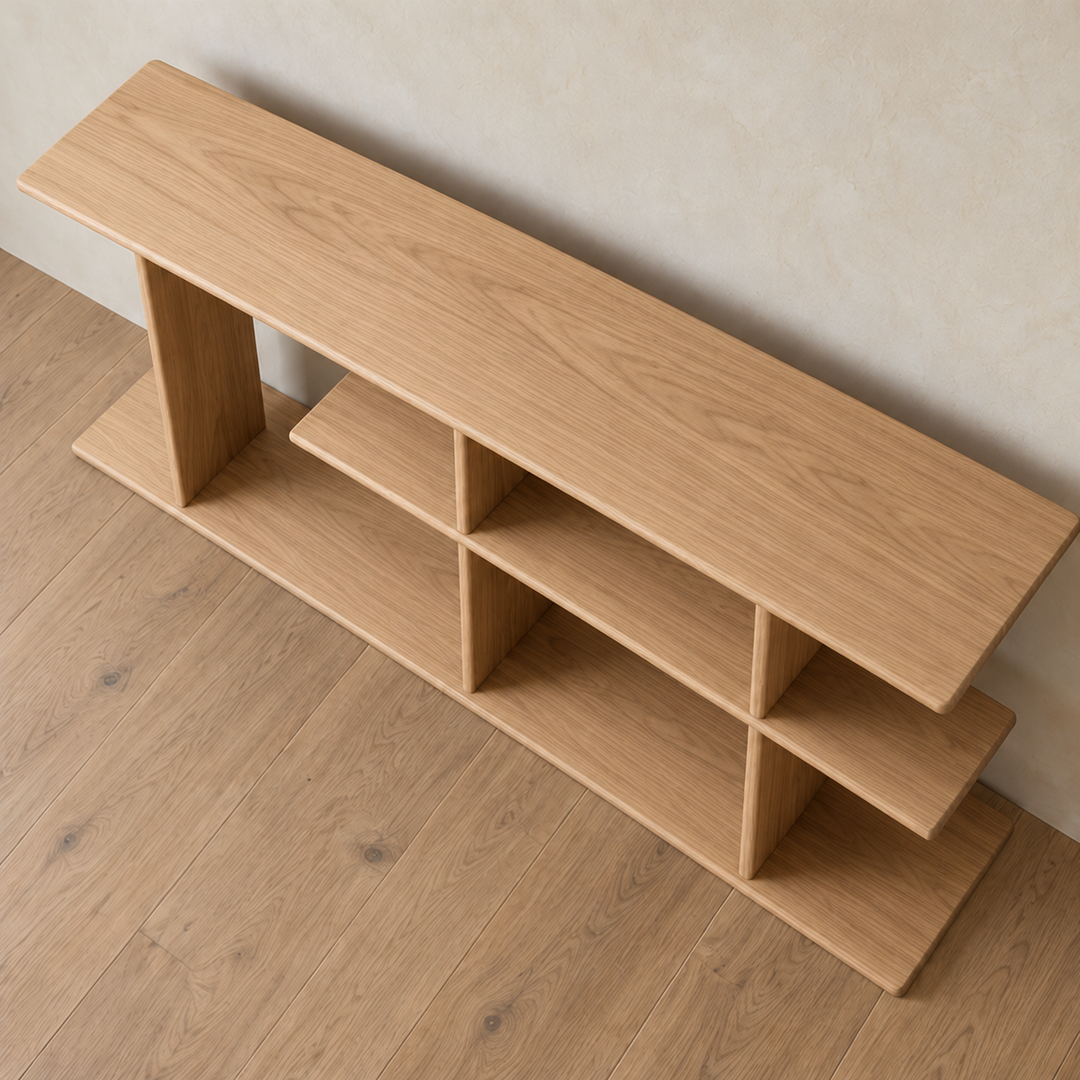 The staggered shelf bookcase in white oak seen from above, showing the long top board and the offset middle shelf.
