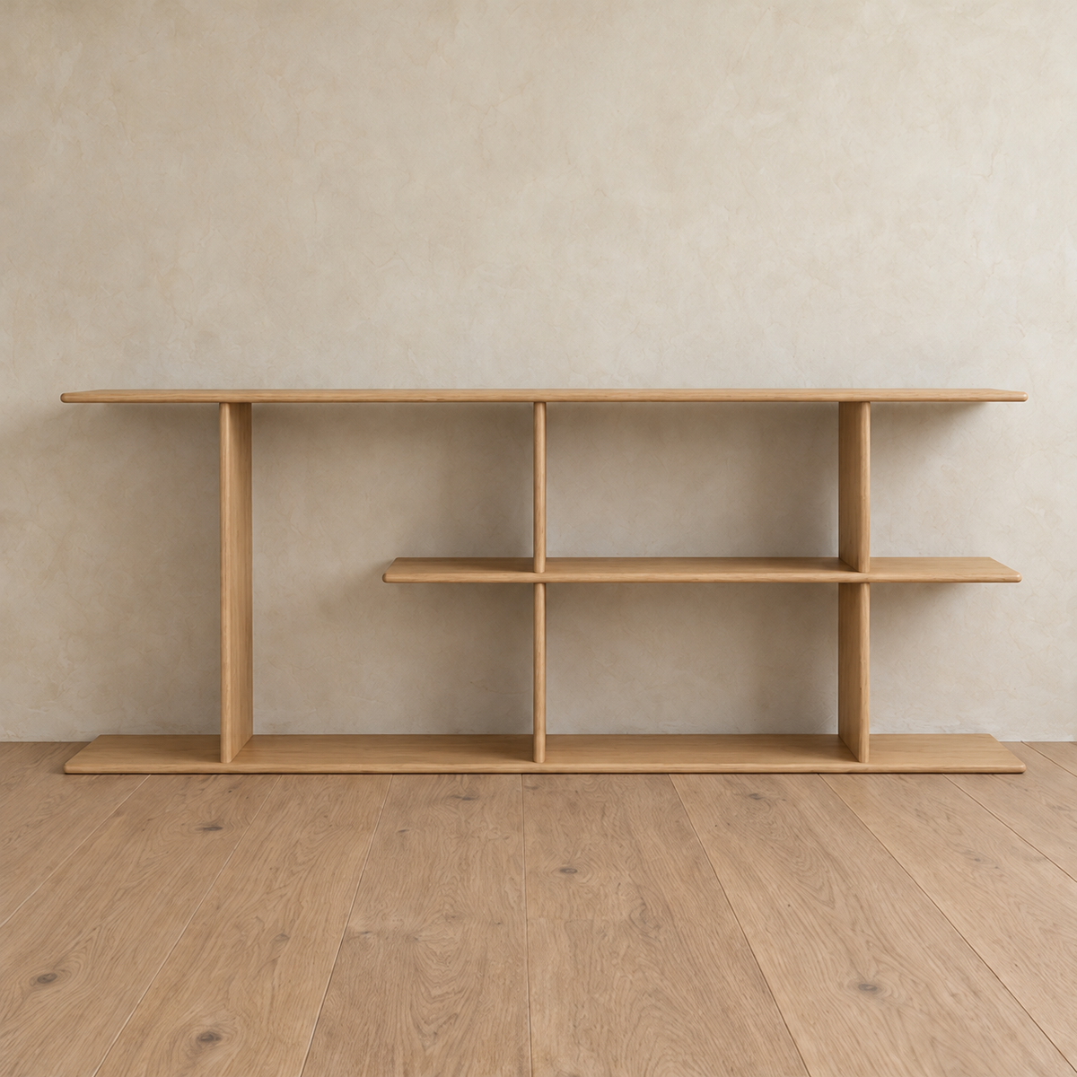 Front view of the empty staggered shelf bookcase in white oak, with its middle shelf running two thirds of the way across.