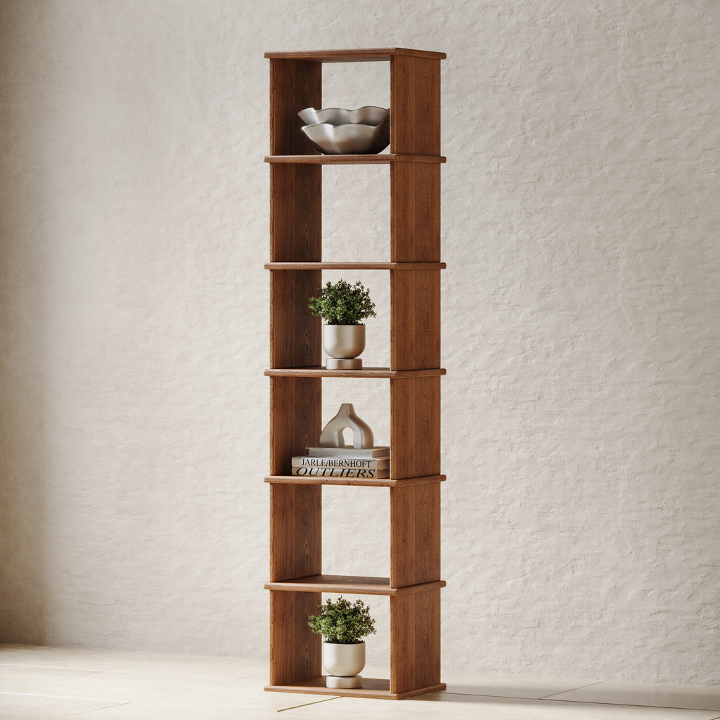 A skinny and tall wooden bookshelf