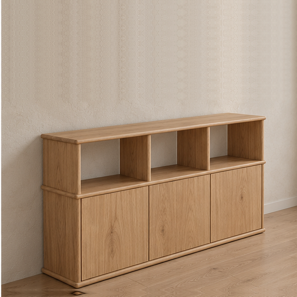The three door sideboard in white oak from an angle, showing the softly rounded edges of its top and shelves.