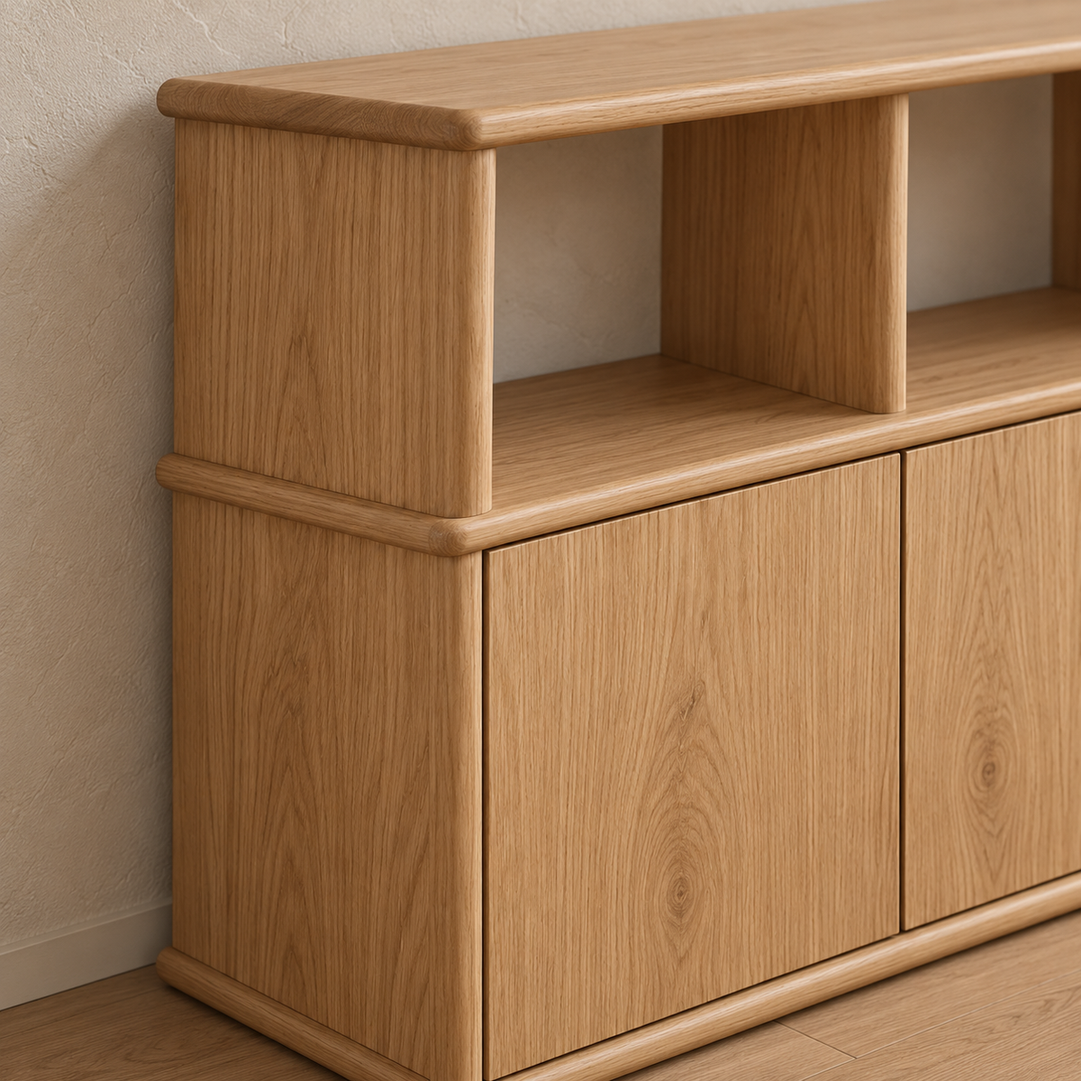 Close-up of a corner of the three door sideboard in white oak, showing the rounded edges of the top and middle shelf.