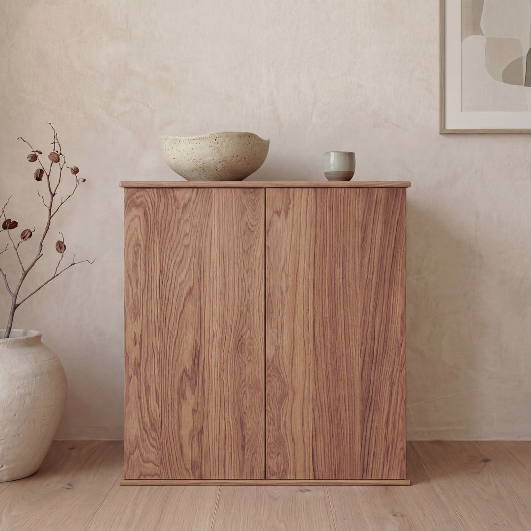 Two door cabinet in red oak — with decor