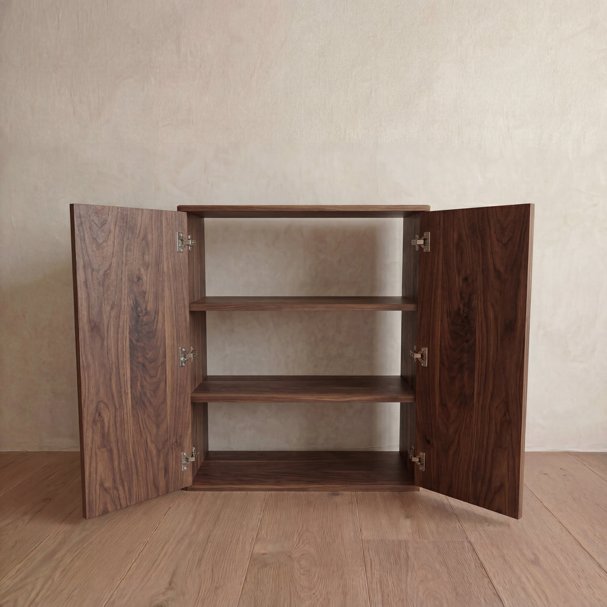 Two door cabinet in walnut — doors open